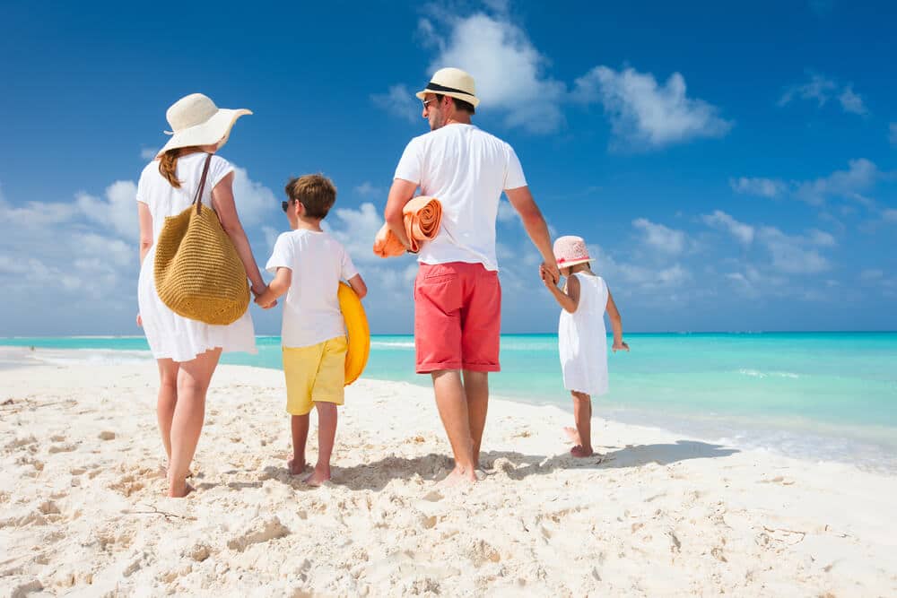 A picture of a family on a beach.