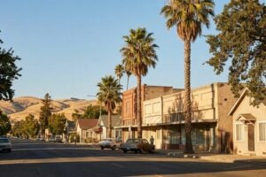 Quiet small-town main street in an affordable California town at golden hour