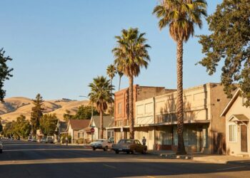 Quiet small-town main street in an affordable California town at golden hour